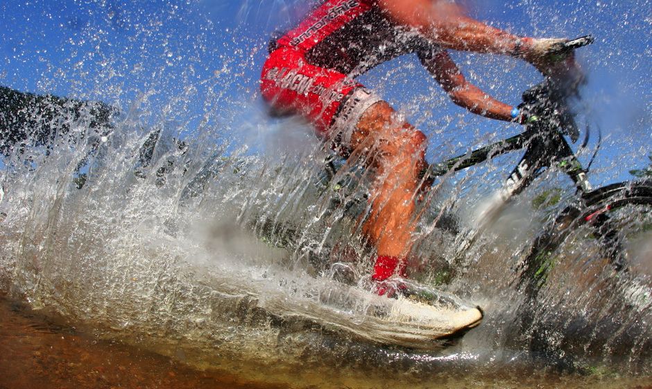 bike cyling in water splash
